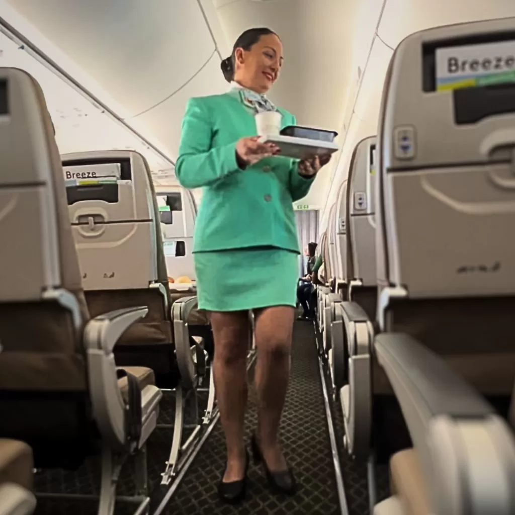 Cyprus Airways Air hostess serving on the first direct flight from Larnaca Cyprus to Nice France (Cyprus Airways)