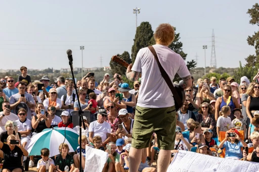 Ed Sheeran performs for British troops and their families on the rugby pitch at the British base in Dhekelia, Cyprus.